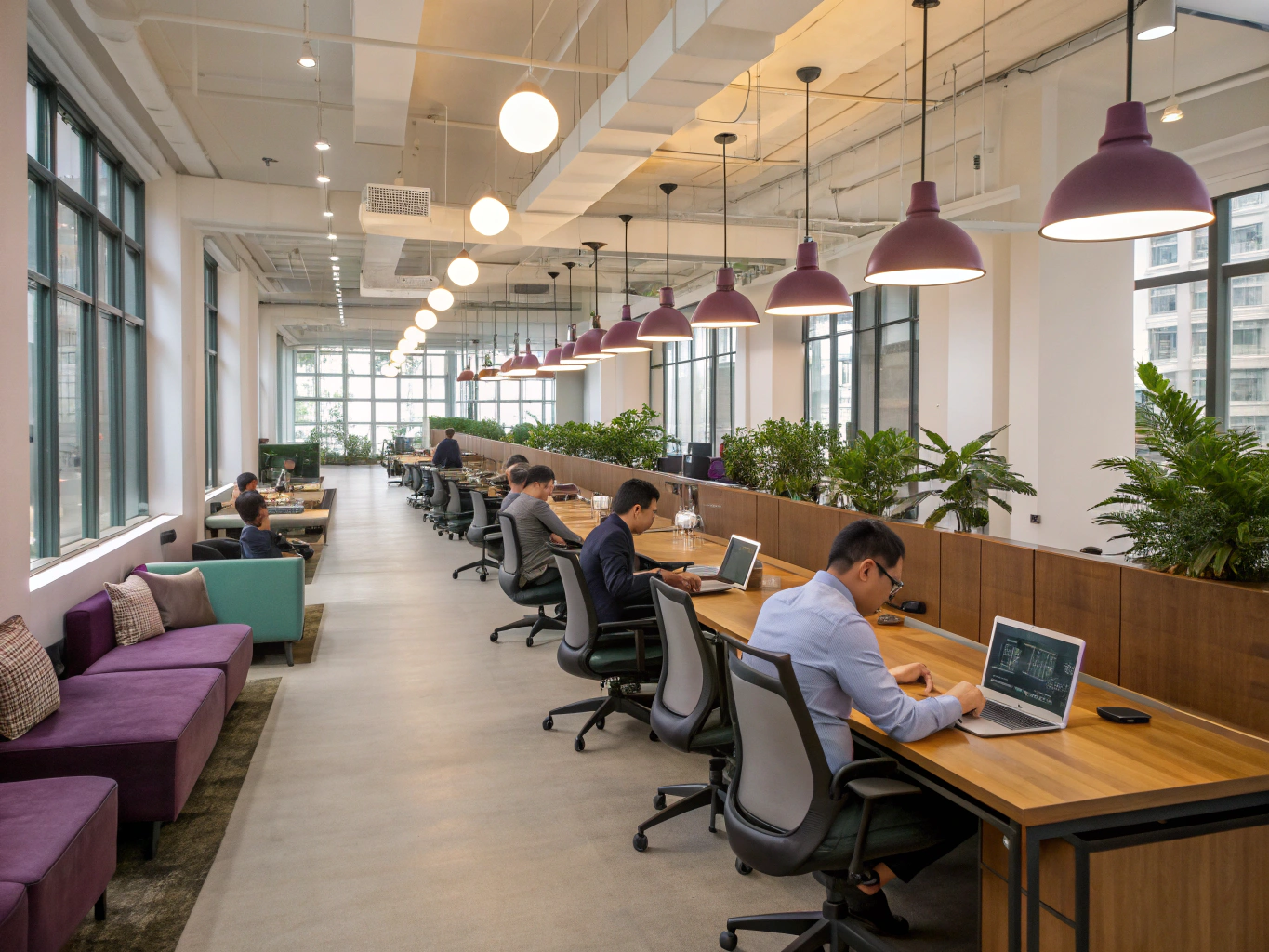 Area open space con postazioni ergonomiche e luce naturale